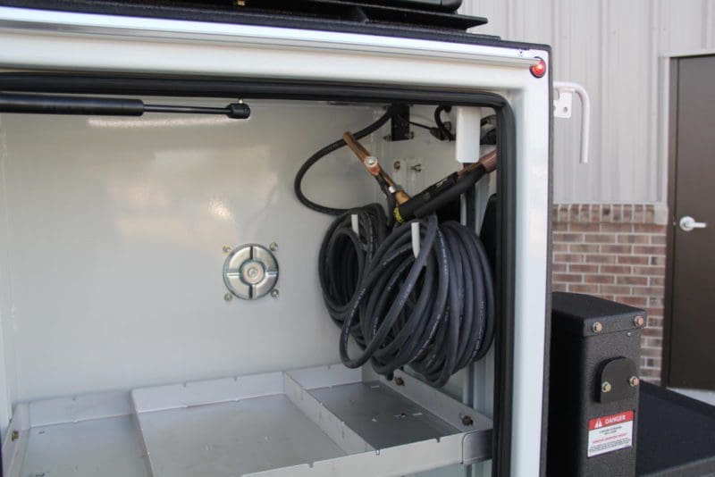 Welder leads hubbled through compatment - gallery